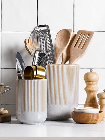 LE TAUCI utensil holder with spatulas organized on a kitchen counter