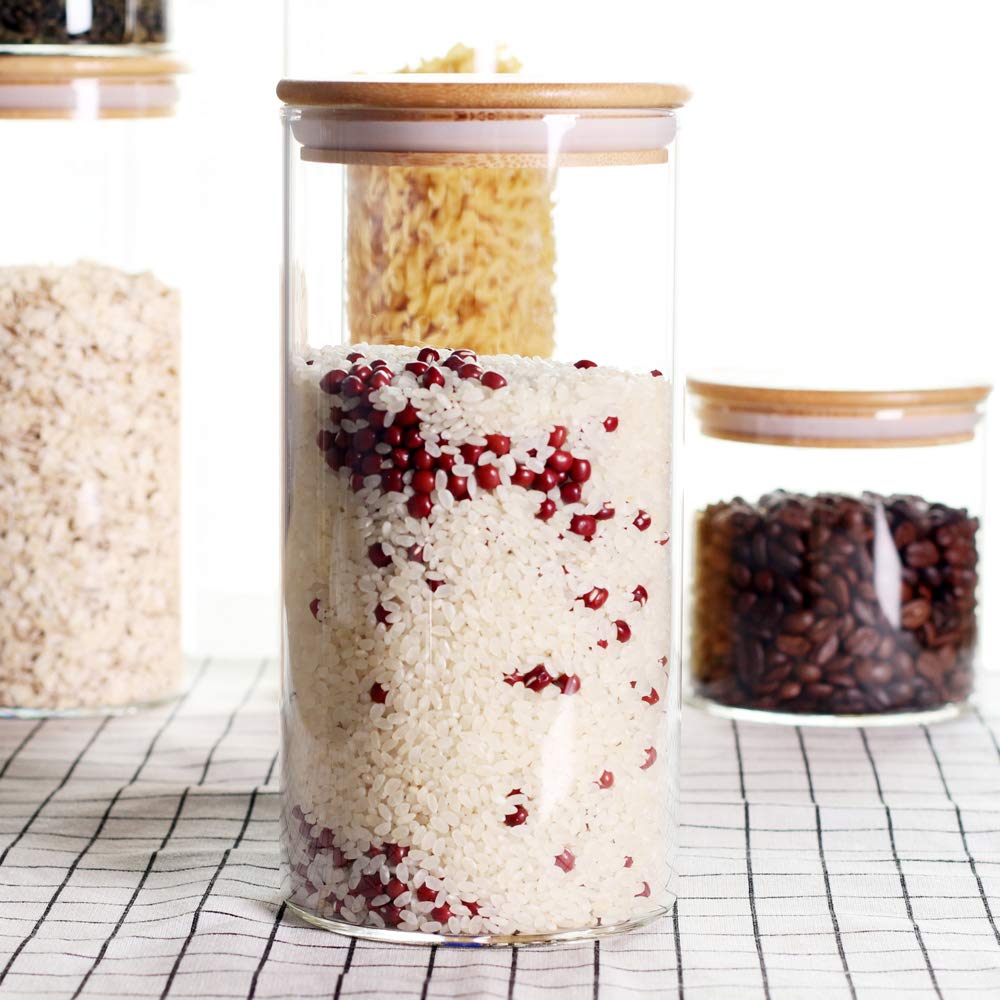Leaves and Trees Y clear glass canisters with honey and cookies on the counter
