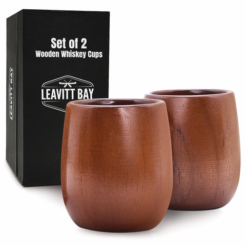 LEAVITT BAY COFFEE teak whiskey glass set of two on a bar, ideal for savoring.