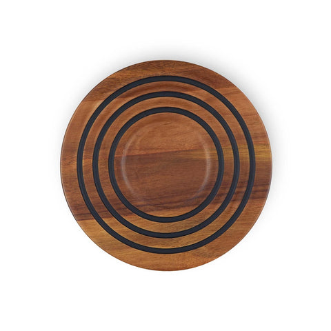 Le Creuset magnetic wooden trivet in acacia wood, heat-safe base for cookware.