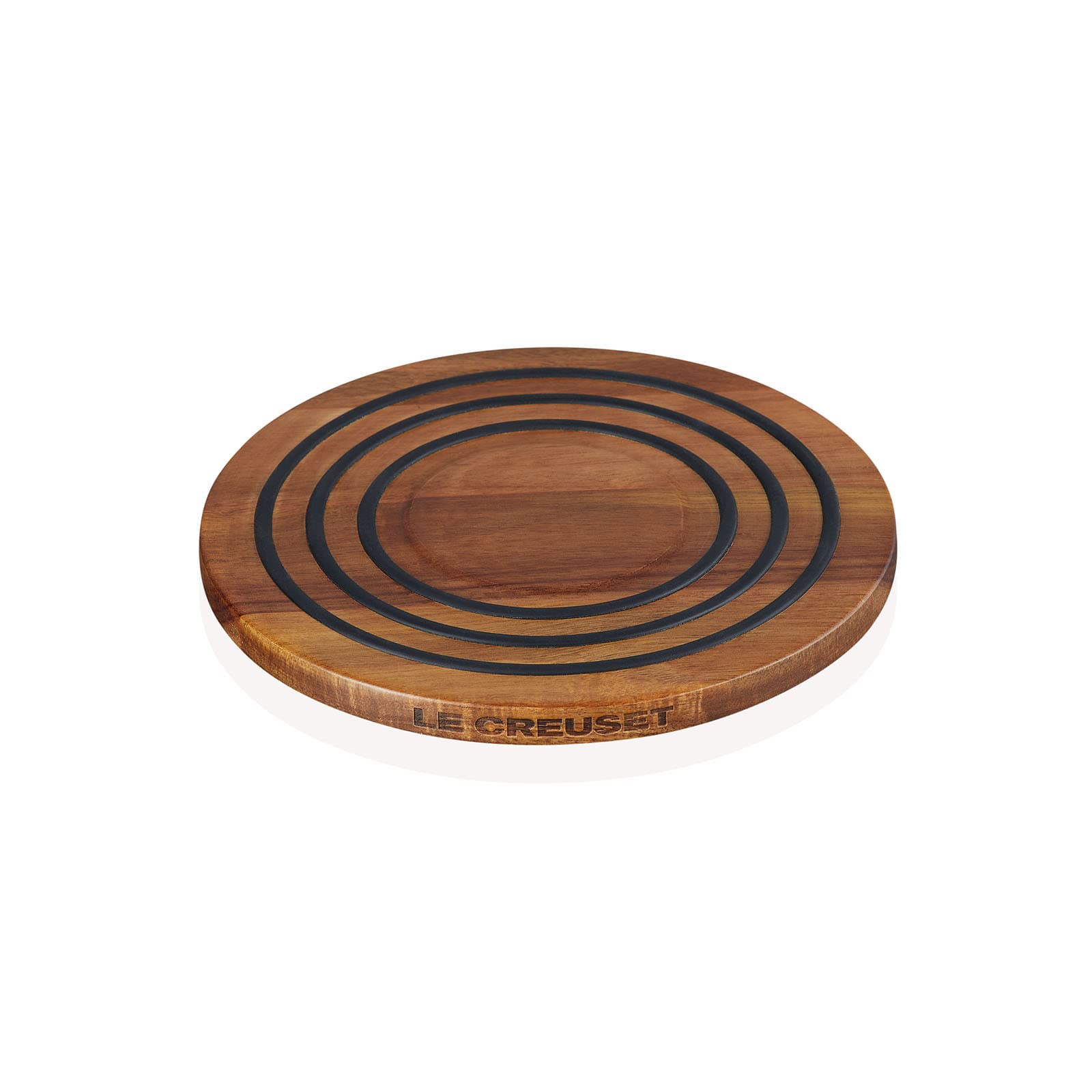 Le Creuset trivet with top silicone rings provides cushioned, heat-resistant support.