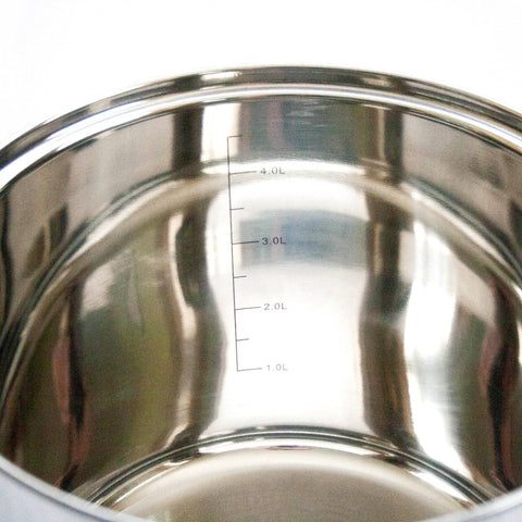 Lehman's popcorn popper shown on induction cooktop for versatile use.