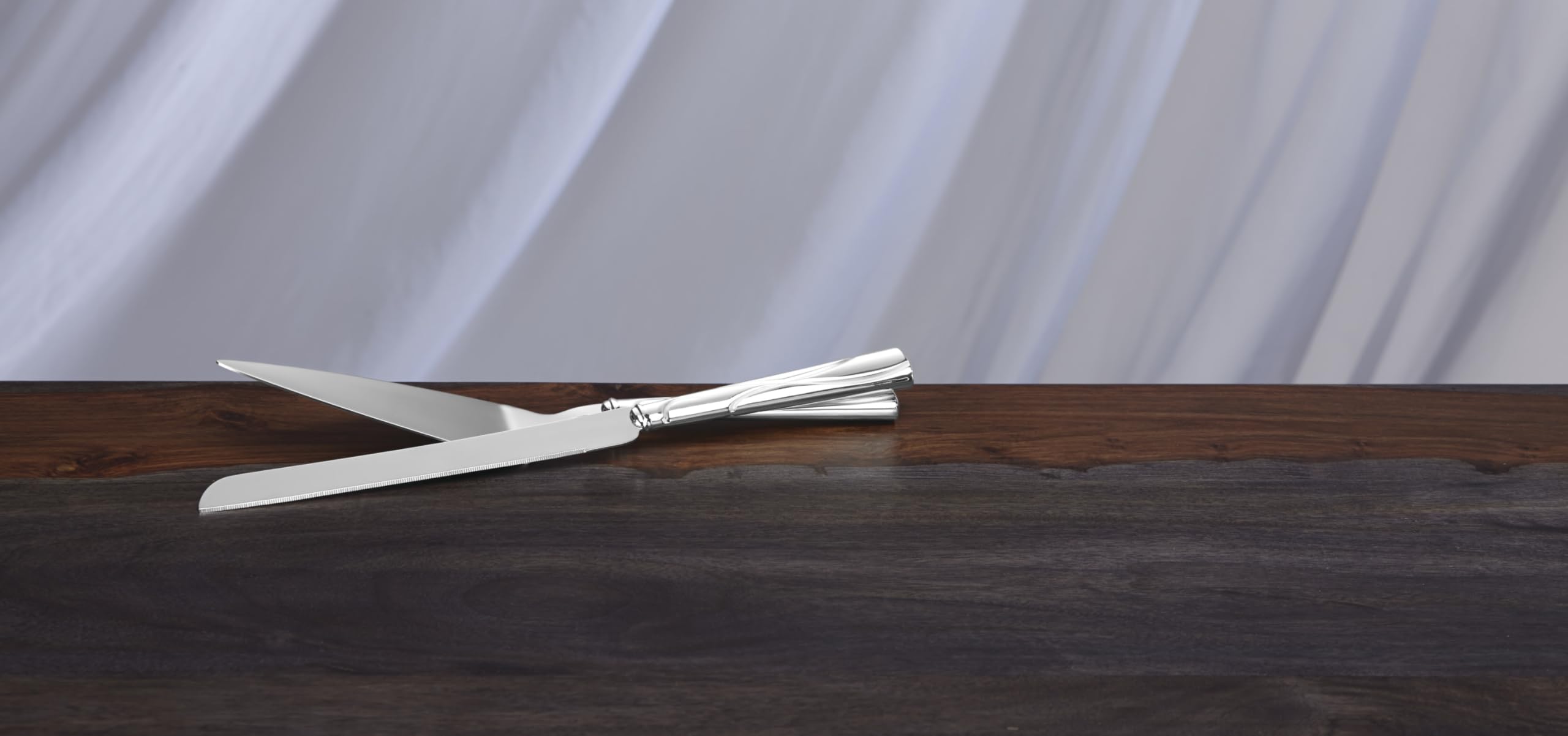 Lenox Adorn dessert set handles shine with a silver-plated finish.