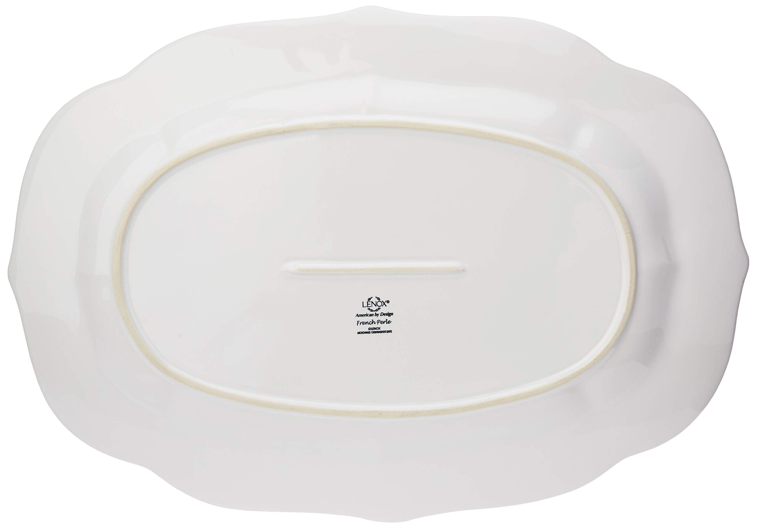 Detailed view of the tea-stained rim on the Lenox French Perle platter.