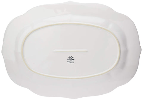 Detailed view of the tea-stained rim on the Lenox French Perle platter.
