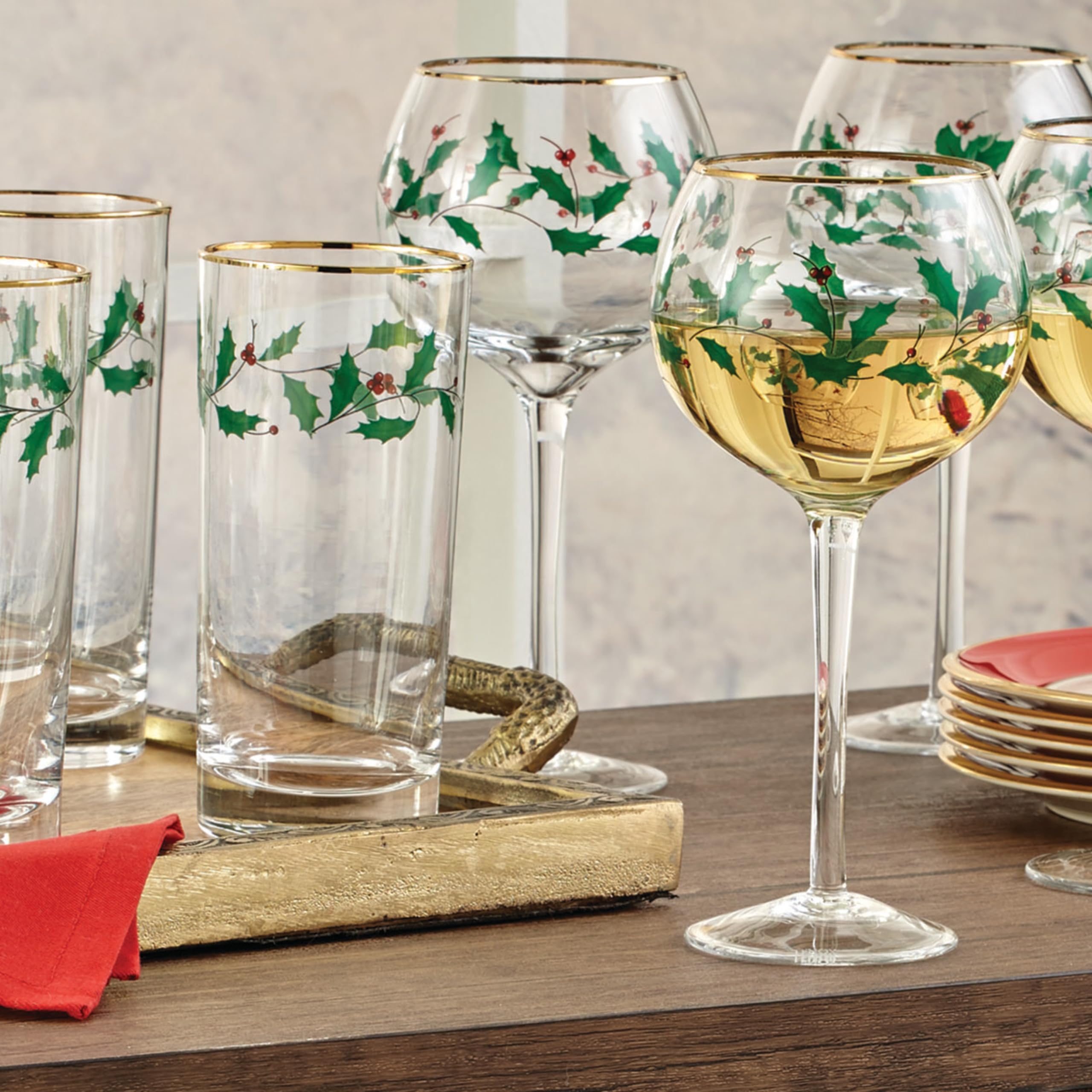 Holding a Lenox Holiday glass to enjoy a cold drink in style.