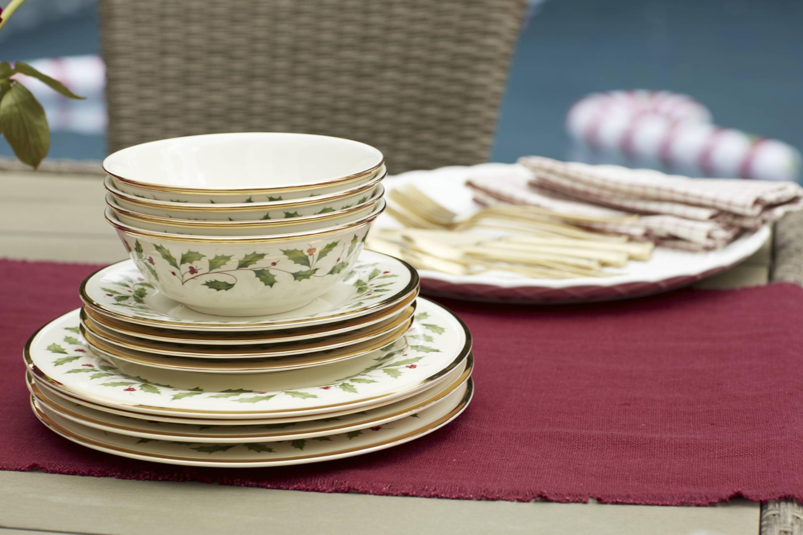 Close-up shows 24K gold accents catching light on Lenox Holiday dinnerware