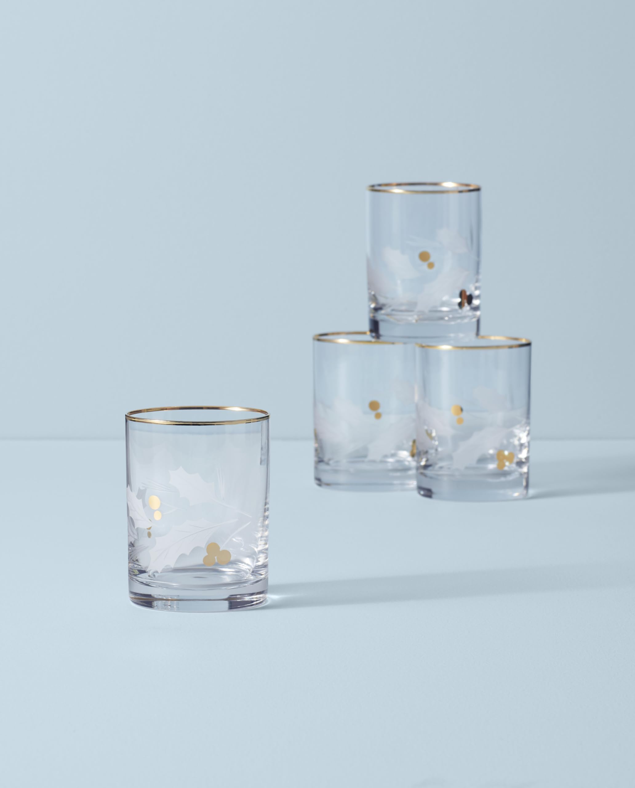 Etched holly leaves with golden berries pattern on Lenox glass.
