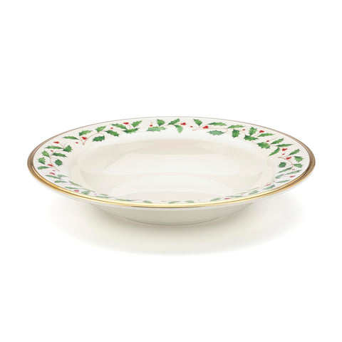 Lenox Holiday soup bowl with holly and berry motif adds festive elegance to meals.