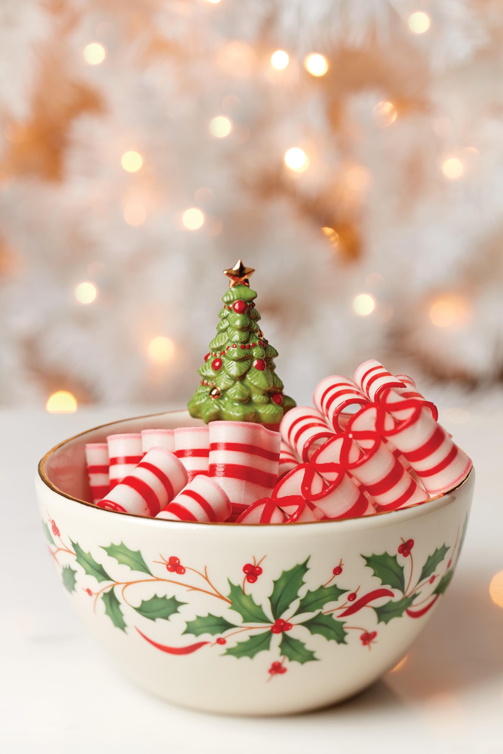 Lenox Holiday Tree Bowl features candy canes, brightening holiday centerpieces and gatherings.