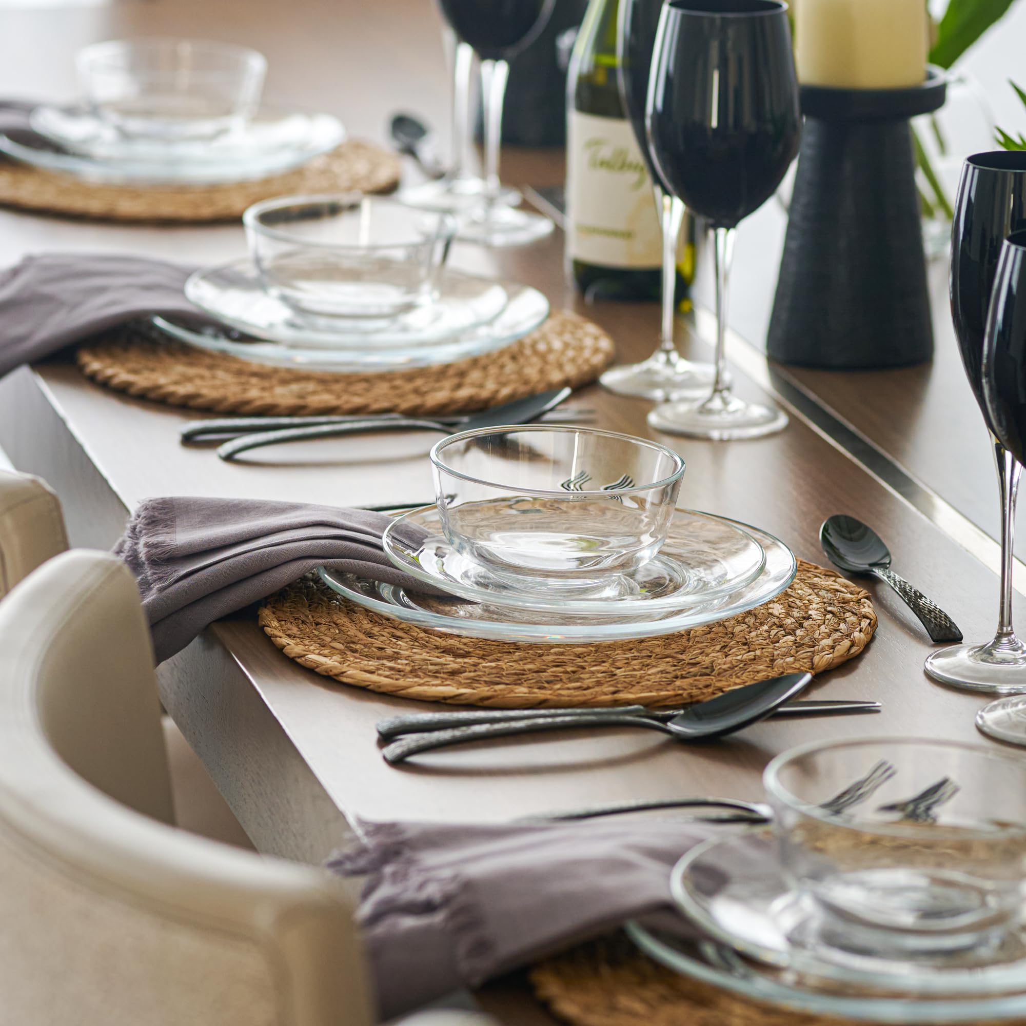 Le'raze 12-piece glass dinnerware on a stylish table setting for an intimate dinner party.