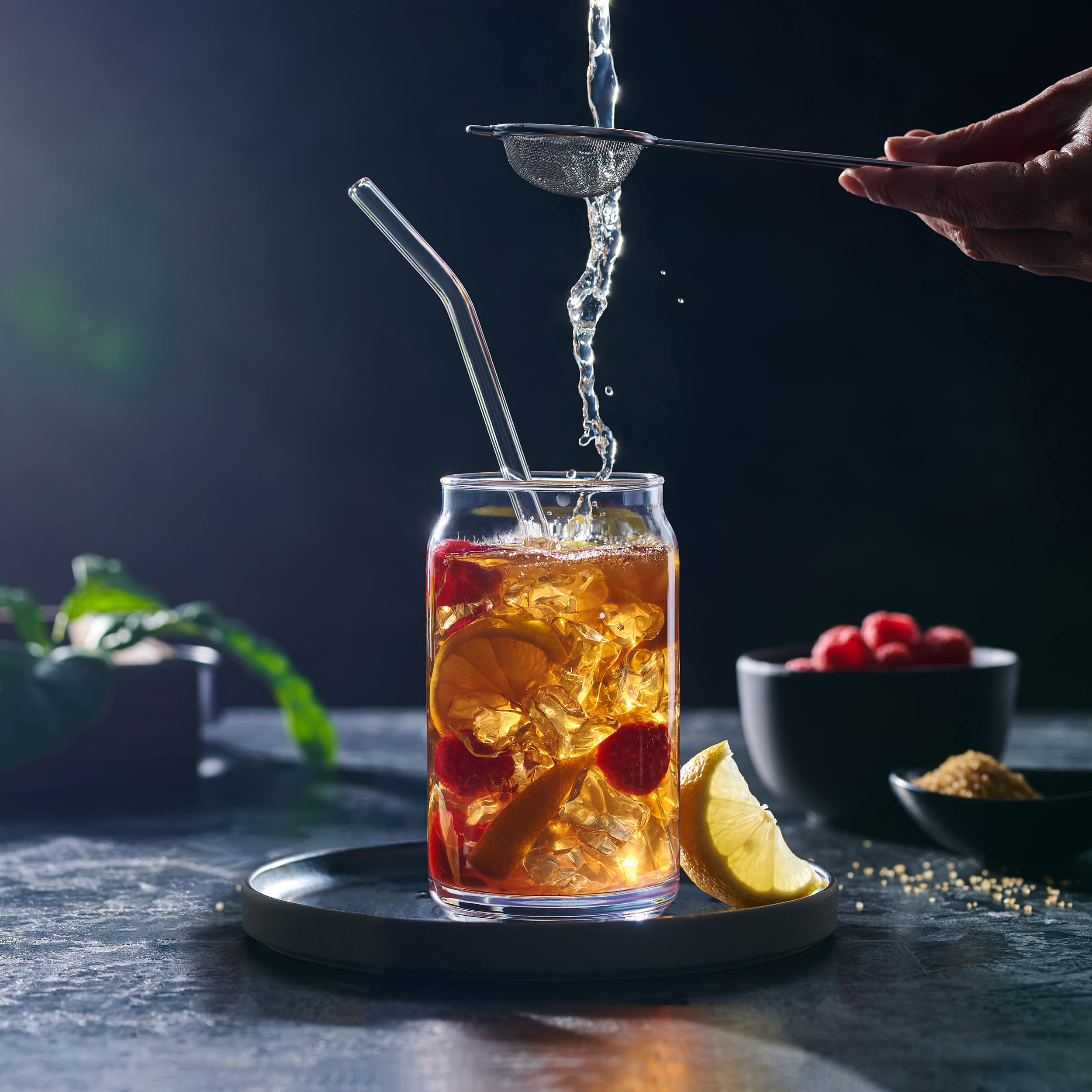Close-up of Le'raze 16oz glass with straw for iced drinks