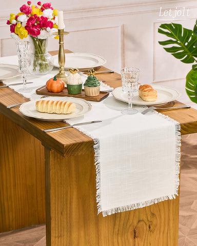 Letjolt white table runner at wedding reception tables adds elegant ambiance.