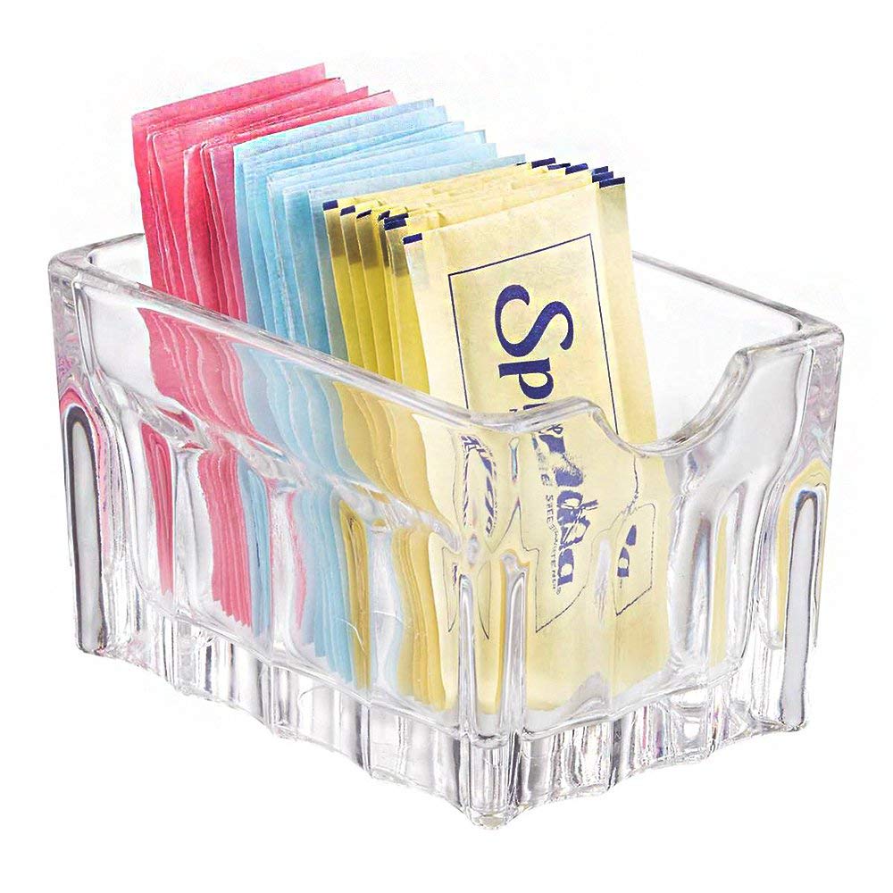 Libbey clear sugar packet holder 5258 on a table keeps packets neatly organized for quick service.