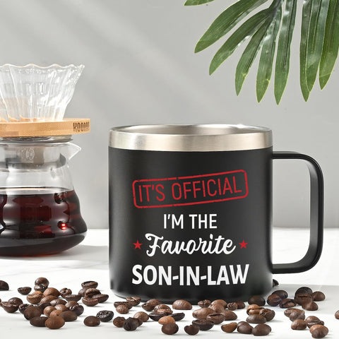 Lifecapido 14oz mug held in hand in an office setting.