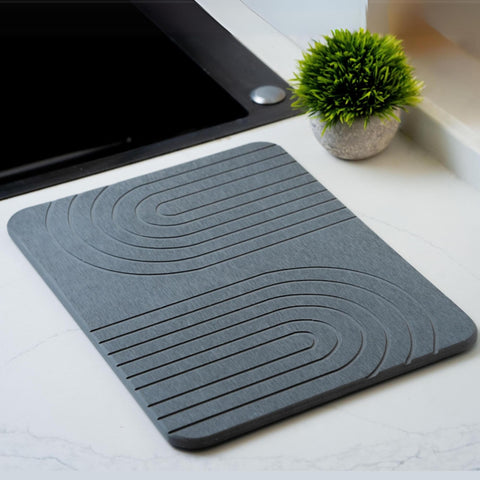 LIFSEZY stone drying mat on counter absorbs moisture quickly for fast-drying dishes.