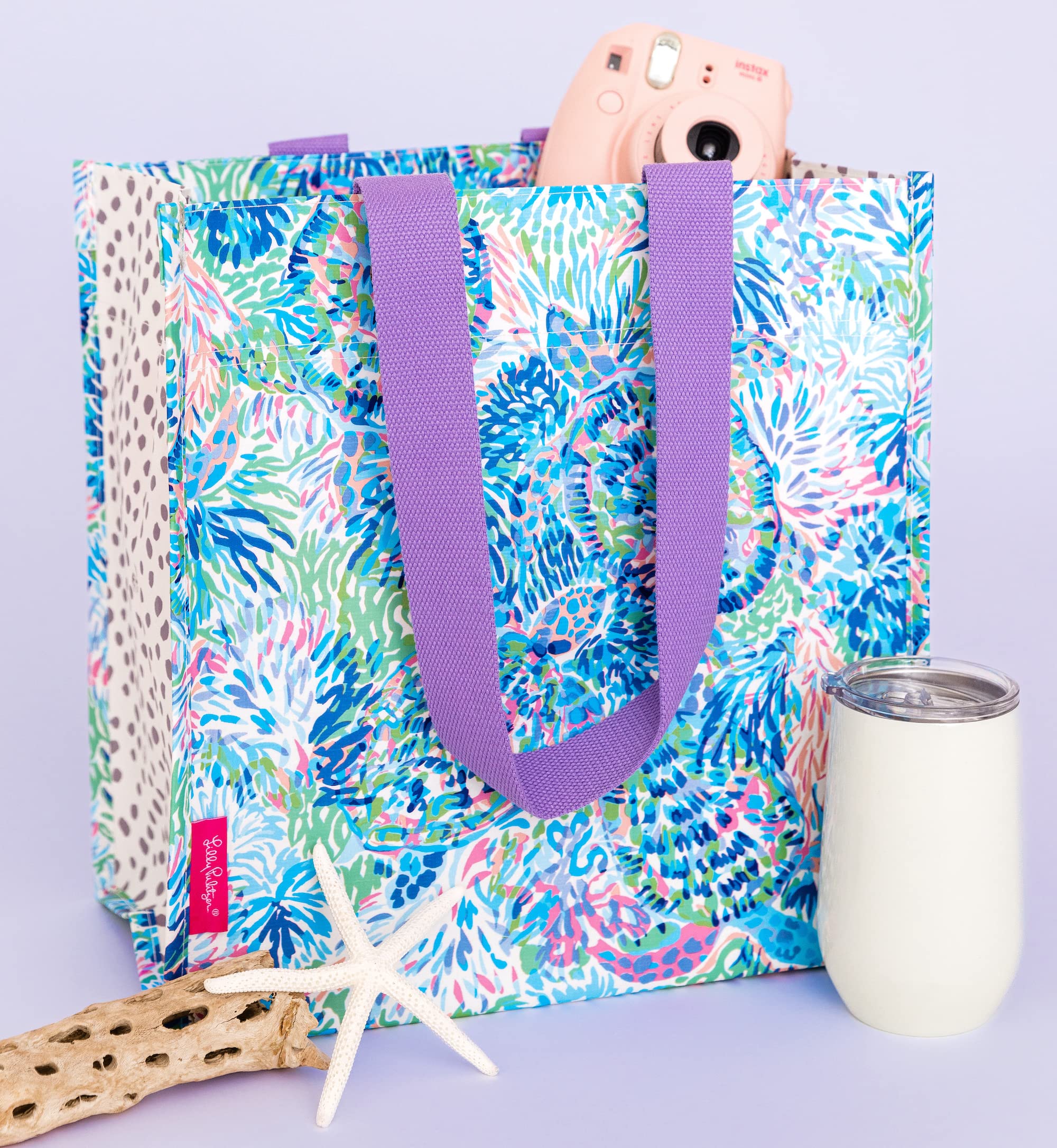 Lilly Pulitzer compact size fits groceries, laundry, or gifts with ease.