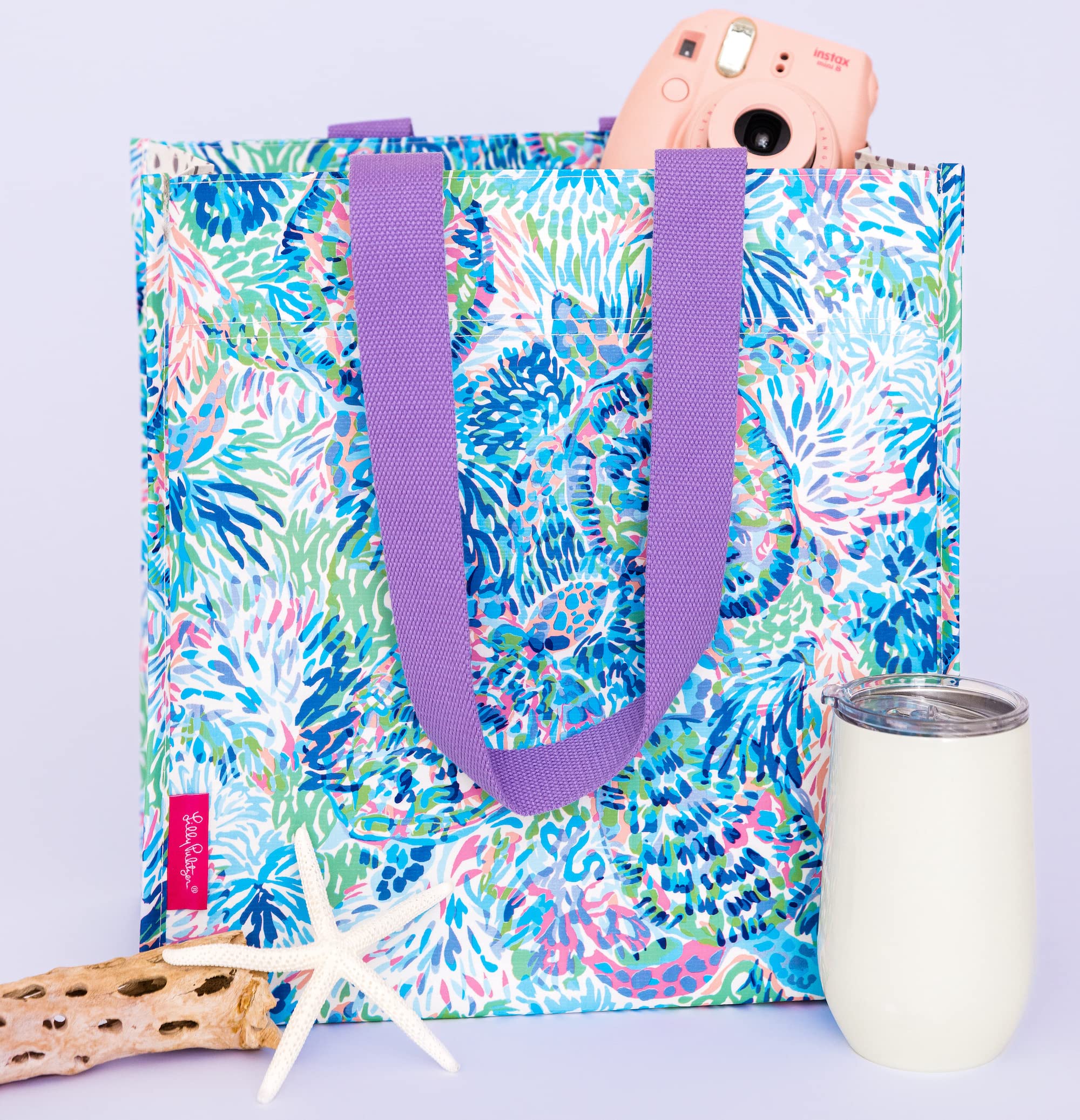Lilly Pulitzer market tote doubles as beach or grocery bag for versatile use.