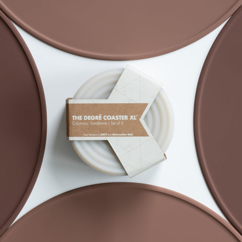 LINE+ARC Degrē coasters on a table show strong surface stability.