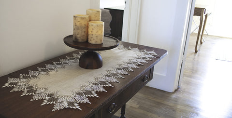 Linens, Art and Things coffee table runner lace adds refined touch.