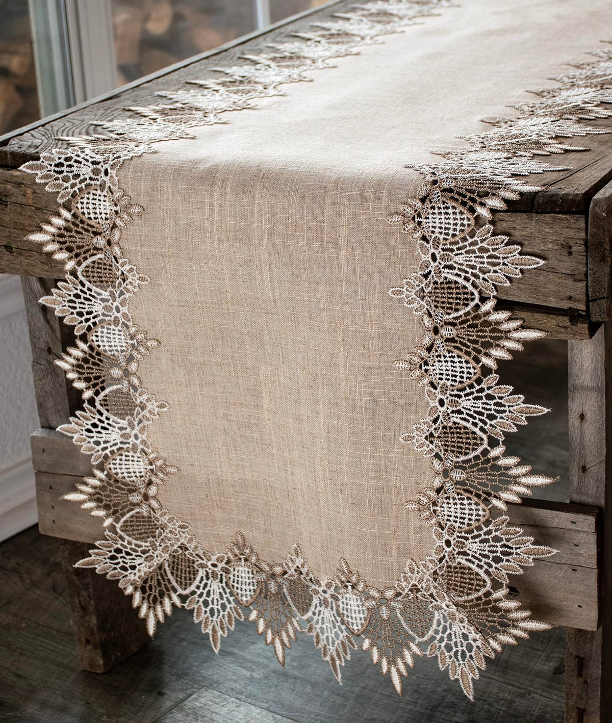 Linens, Art and Things lace runner neutral earth tones enhances a sophisticated dinner table.