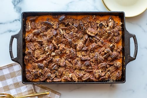 Lodge Cast Iron Baking Pan handle closeup emphasizes grip-friendly design for easy lifting.