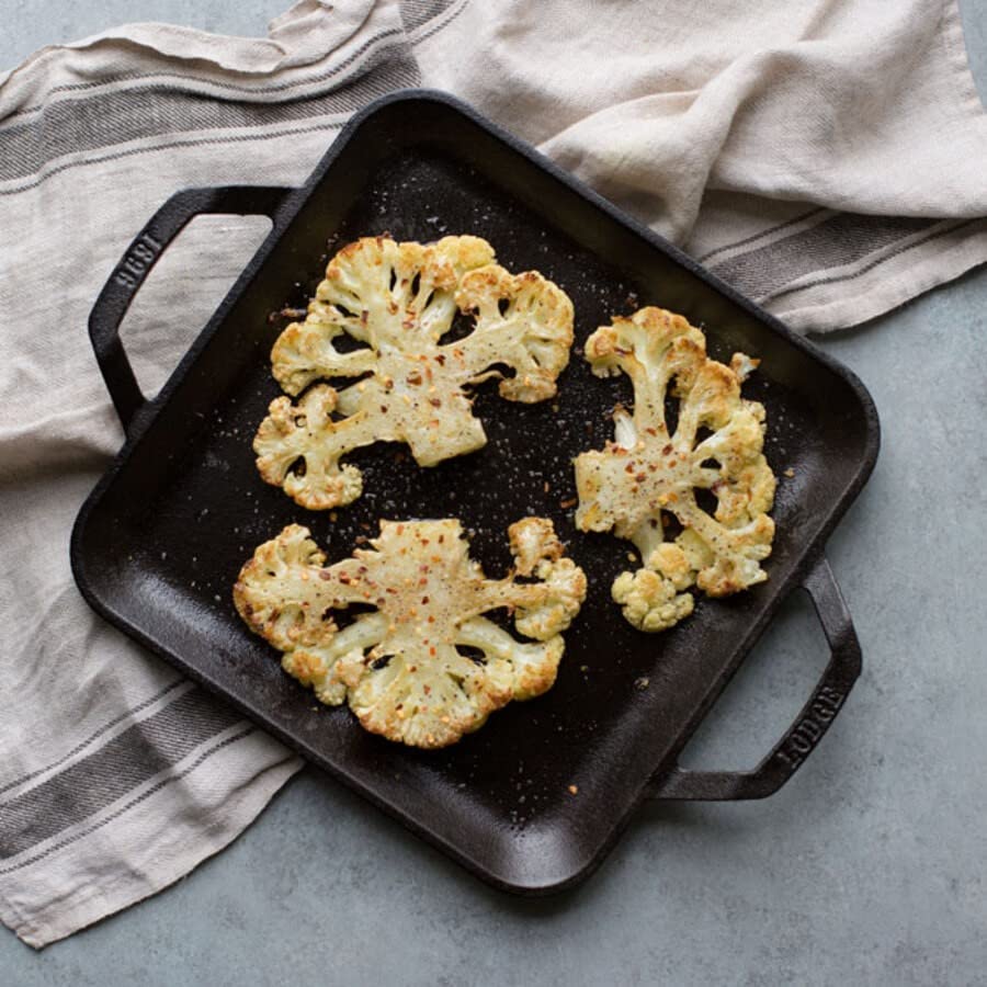 Lodge Chef Collection square griddle handle close-up for easy maneuvering