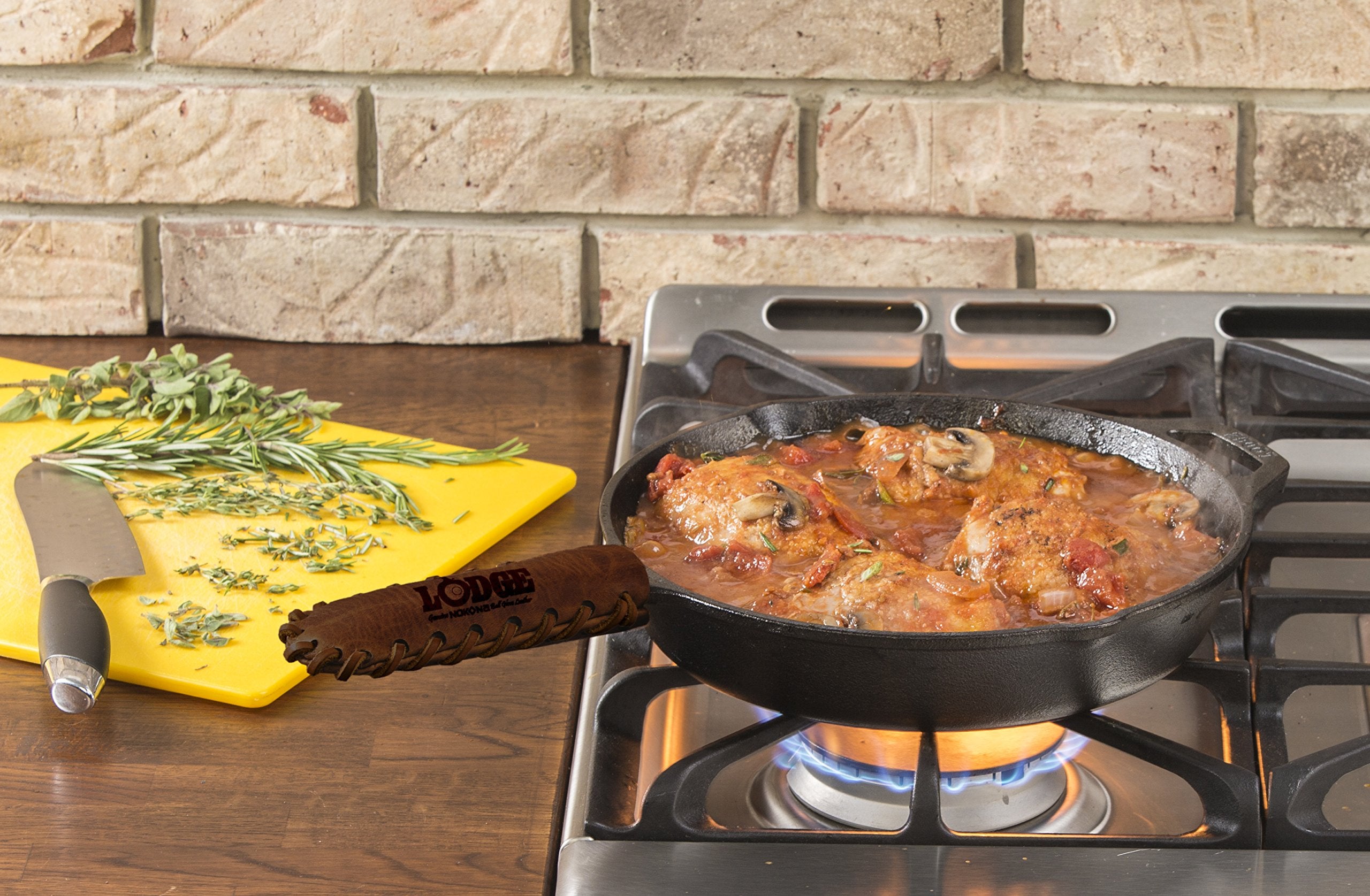 Lodge Nokona leather hot handle holder fits Lodge teardrop handles for safe cooking.