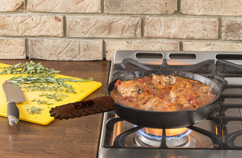 Lodge Nokona leather hot handle holder fits Lodge teardrop handles for safe cooking.