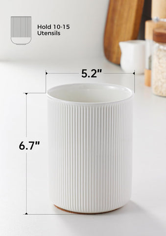 White LoeJan ceramic utensil holder for easy access on the stove.
