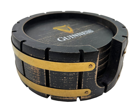 Guinness logo on coasters enhances bar aesthetics with classic black and gold tones.