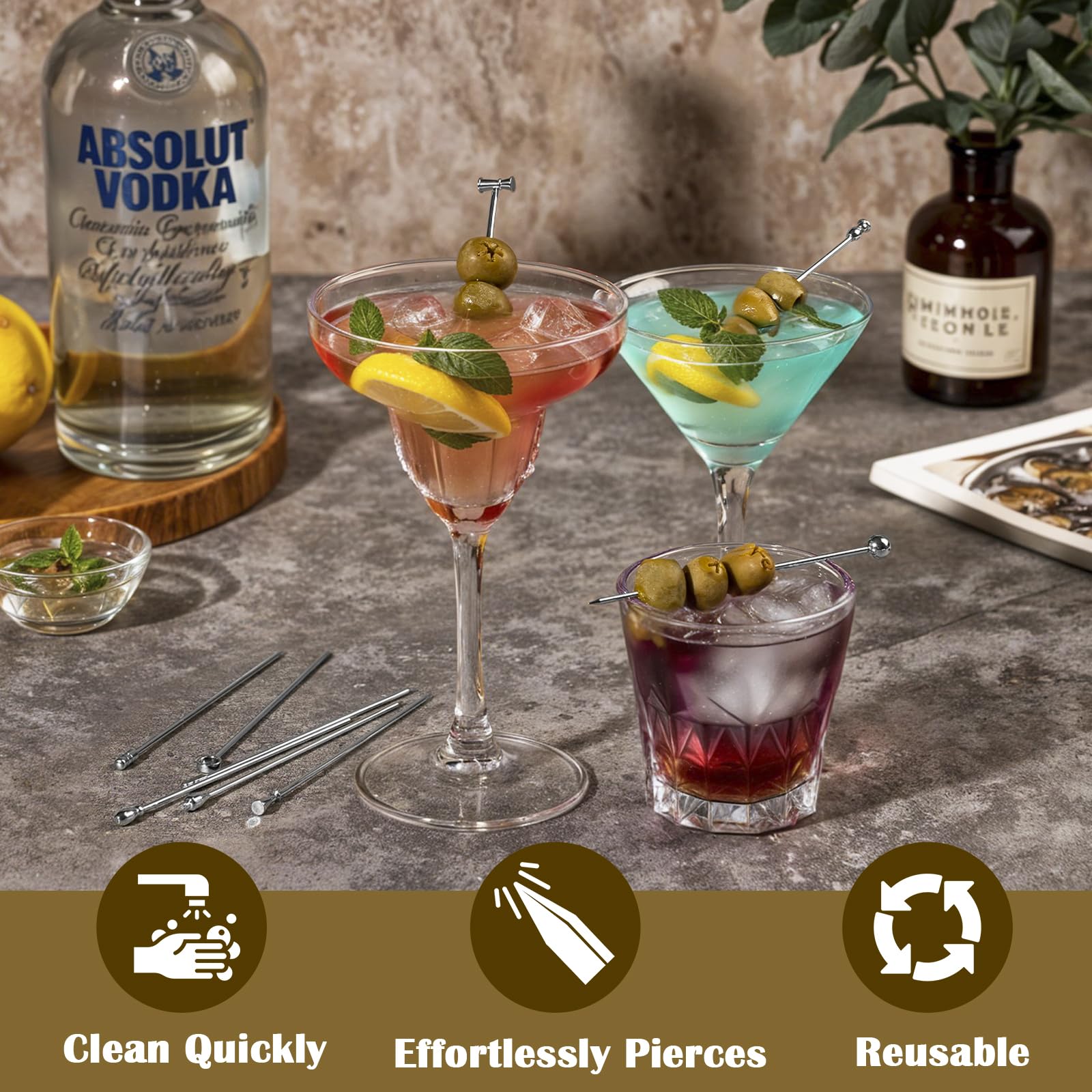 Losneg martini picks skewering olives in a glass for elegant serving.