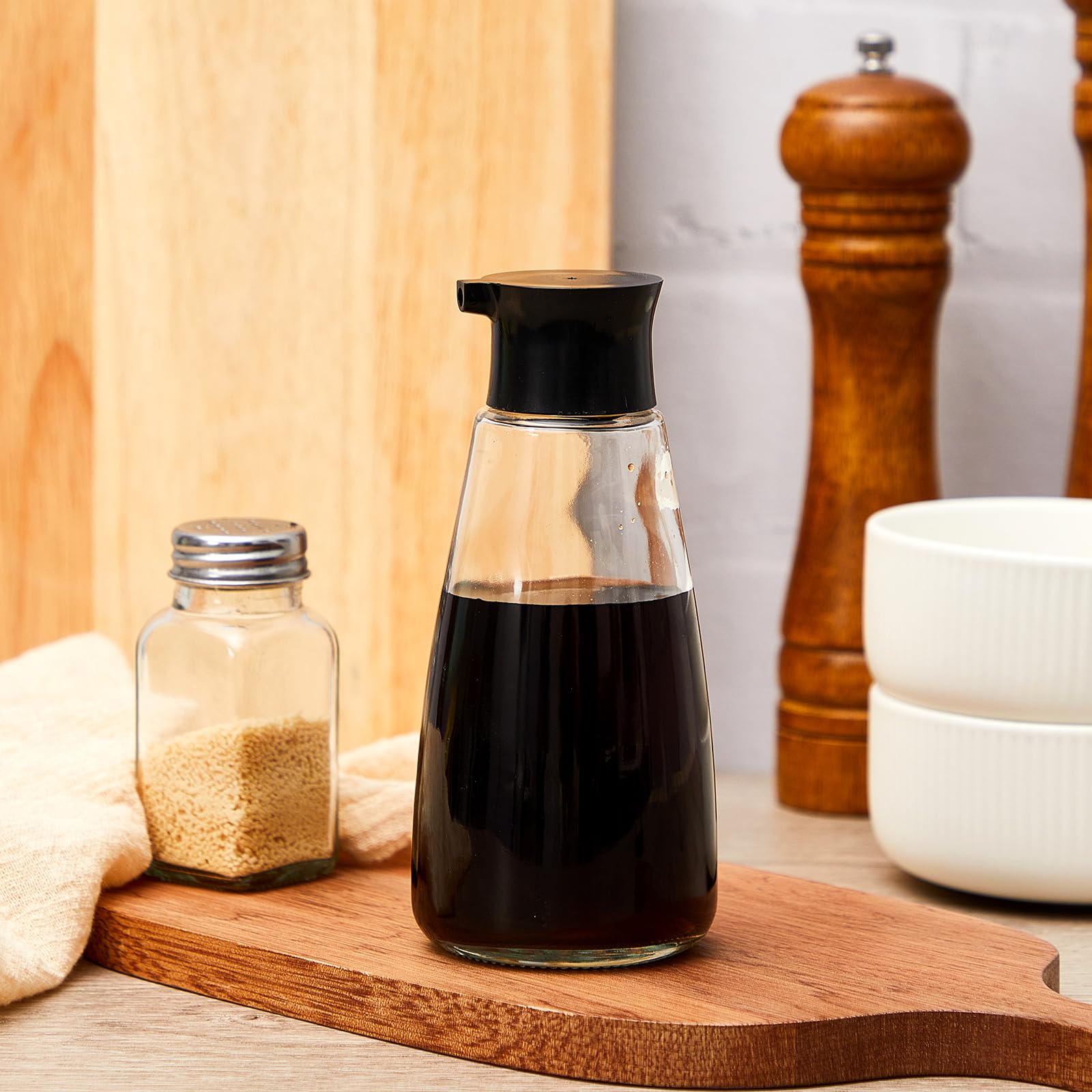 LOYIM cruet dispenser black-cap design prevents leaks and preserves freshness