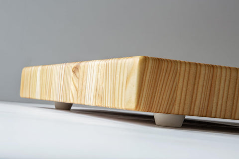 LW Handmade Larch Wood Canada end grain medium cutting board in active kitchen prep scenario
