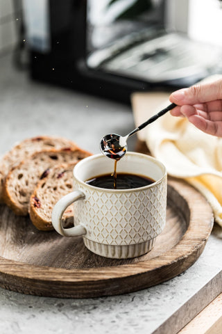 LYEOBOH black stand keeps mugs organized and accessible.