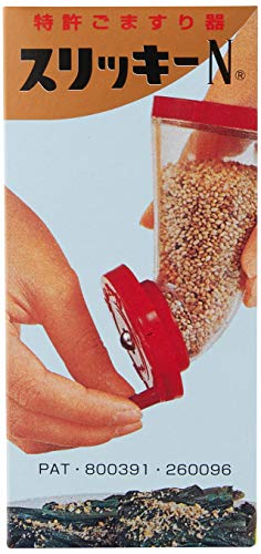 Kotobuki Goma Slicky in use, filling and dispensing sesame seeds for fresh flavor.