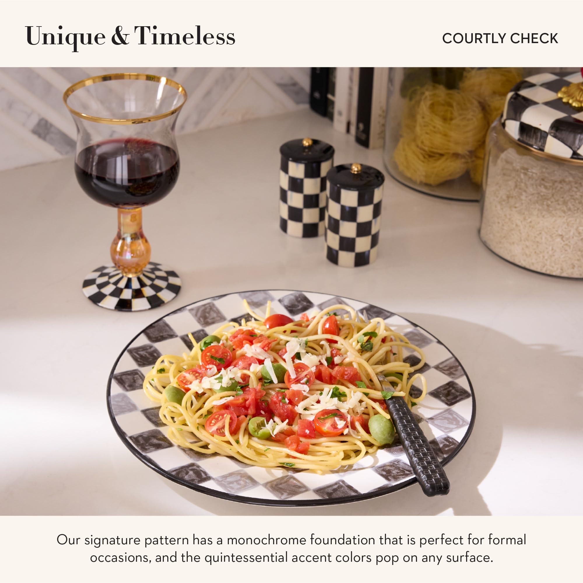 Mackenzie-Childs Courtly Check salt and pepper set elevates dinner table decor.