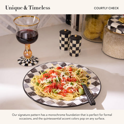 Mackenzie-Childs Courtly Check salt and pepper set elevates dinner table decor.