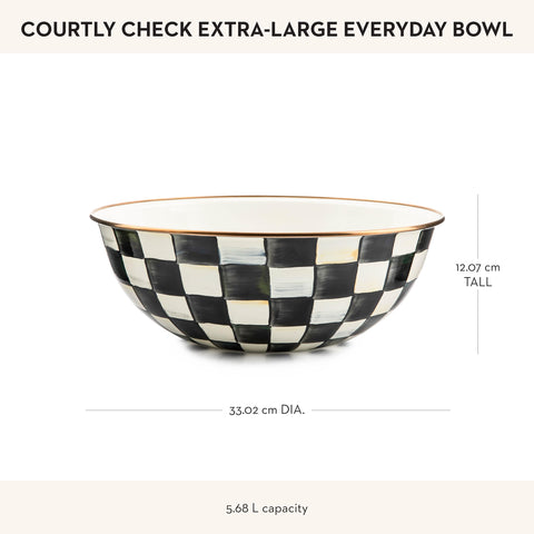 MacKenzie-Childs Courtly Check bowl displayed empty on a dining table.