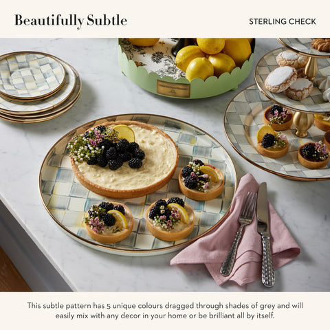 MacKenzie-Childs enamel round tray with hand-painted detail adds artisanal charm.