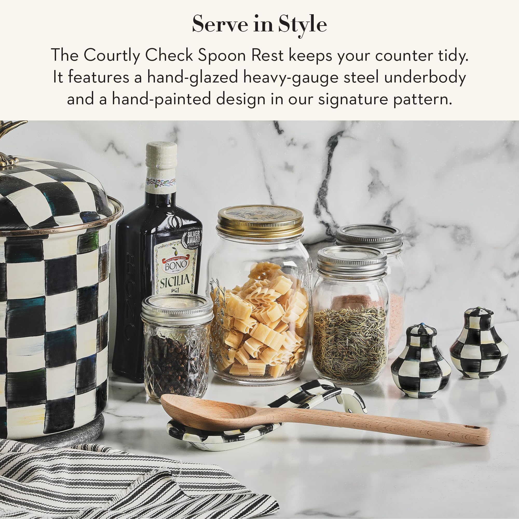 MacKenzie-Childs spoon rest on stovetop adds elegant organization.