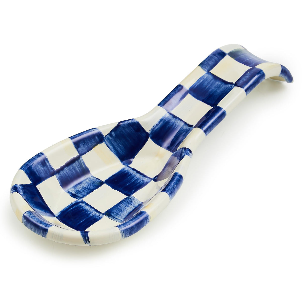 Mackenzie-Childs enamel spoon rest in Royal Check on counter keeps utensils tidy.
