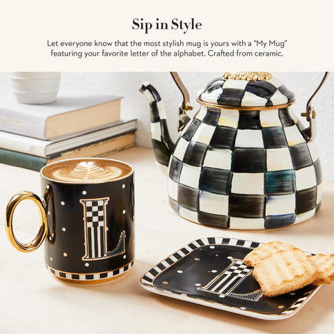 MacKenzie-Childs mug in black and white pattern adds style to daily coffee.