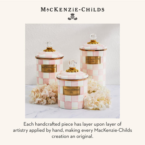Countertop display of MACKENZIE-CHILDS Rosy Check enamel canister ensemble.