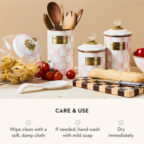 Tabletop display of Rosy Check spoon rest with utensils nearby