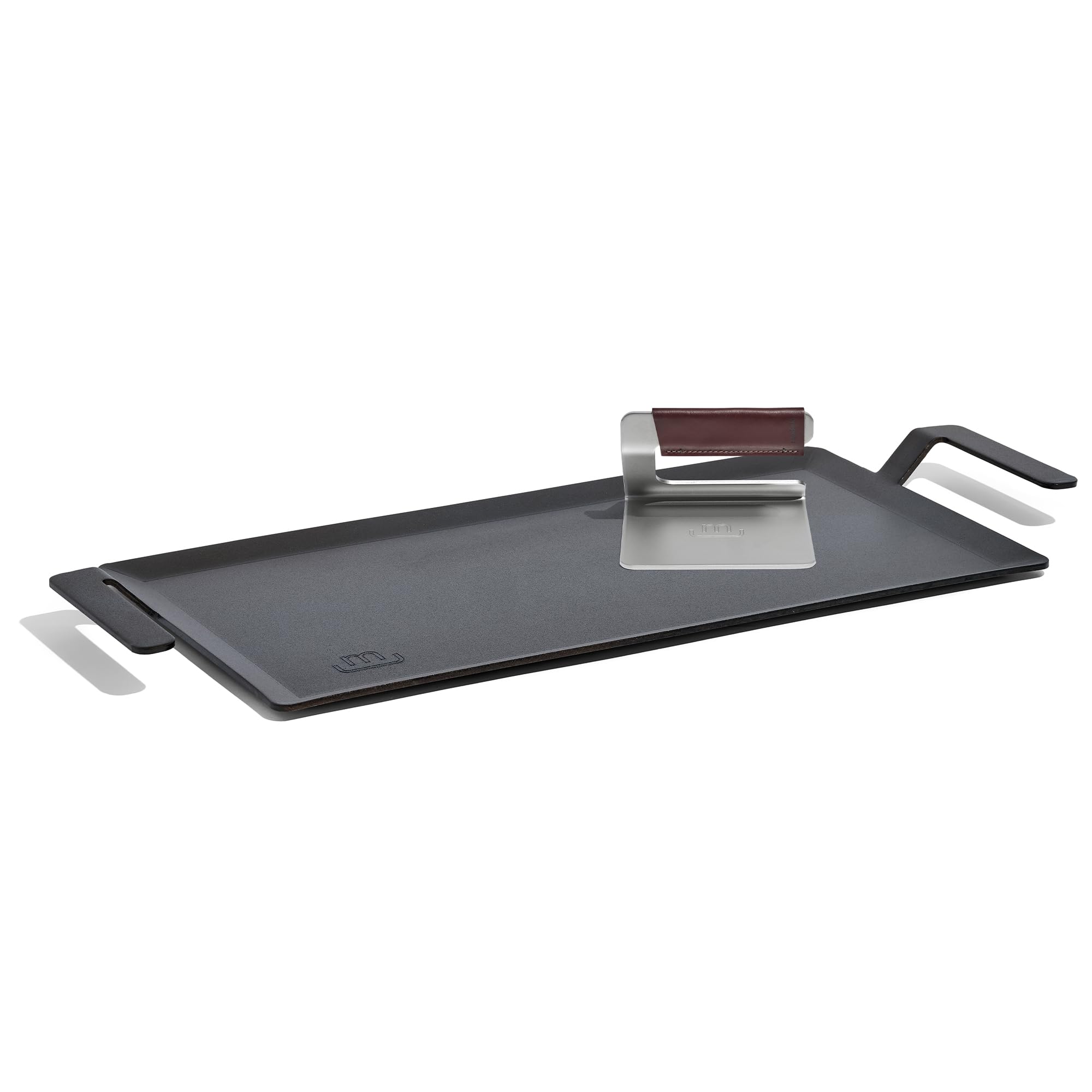 Made In carbon steel griddle surface enables even sear and browning.