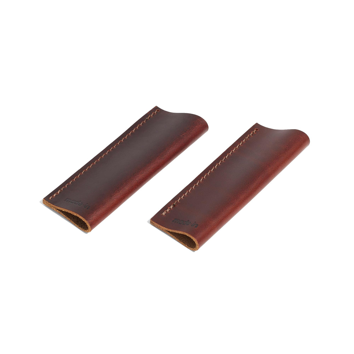 Made In leather handle covers two-piece set on a griddle handle for safer cooking