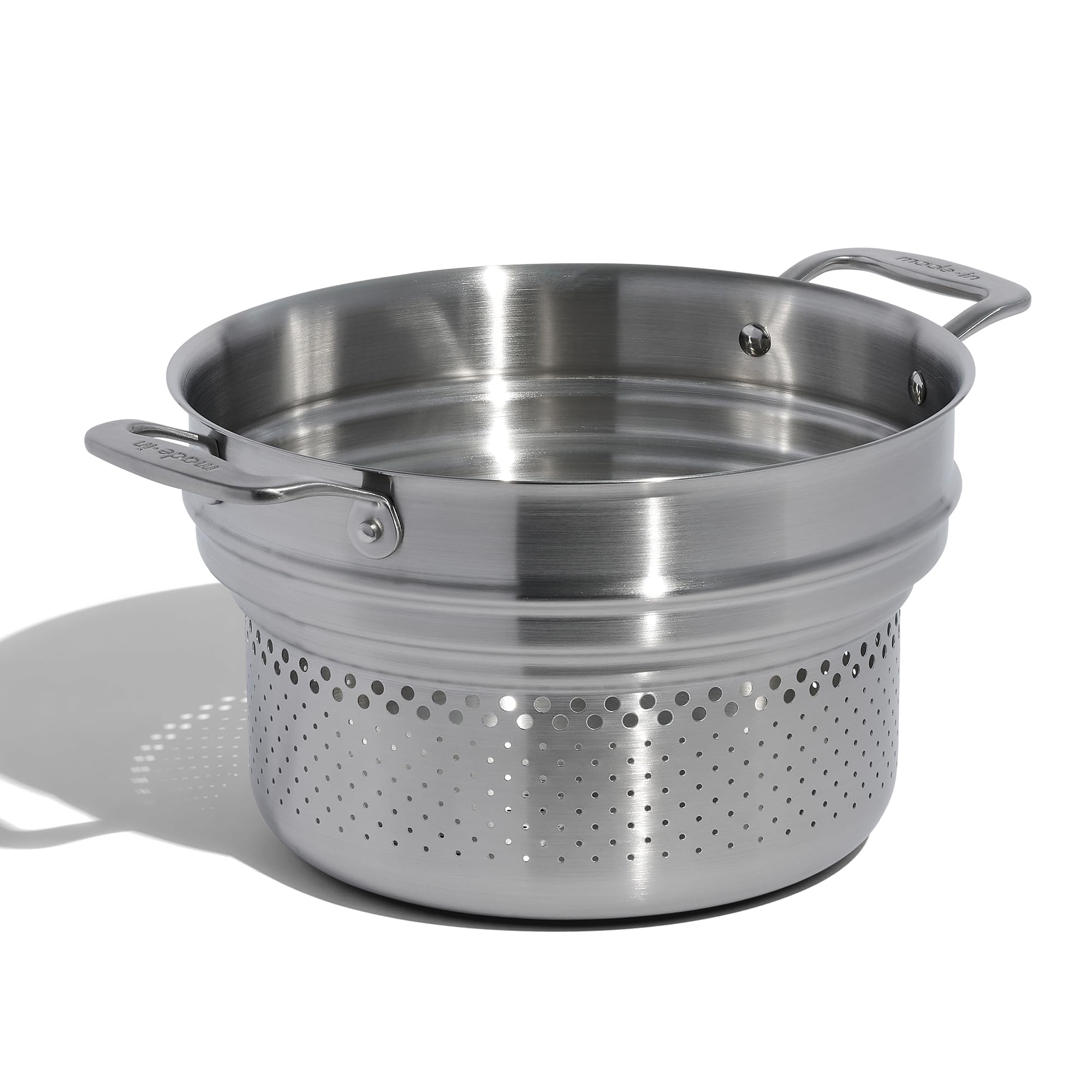 Made In pasta insert assembly on a stock pot promotes even heating.