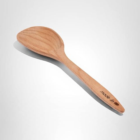 Made In wooden spoon in action, ideal for stirring and tossing