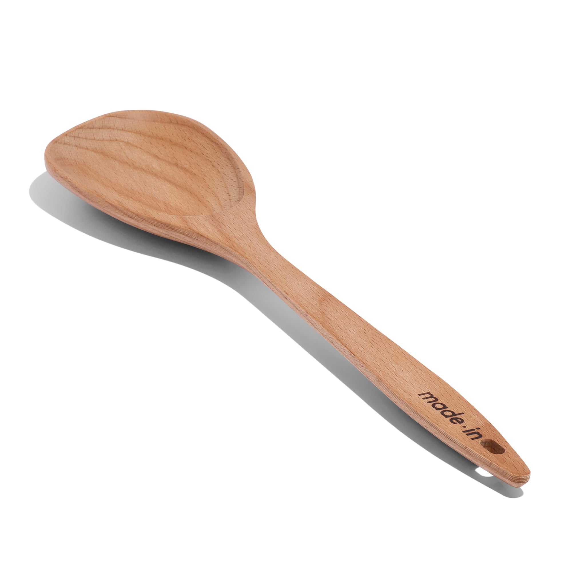 Made In wooden spoon with broad concave bowl for thorough mixing in the kitchen